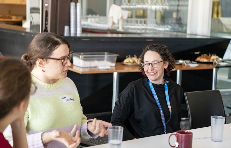 Participants having conversations during the speed mentoring event.