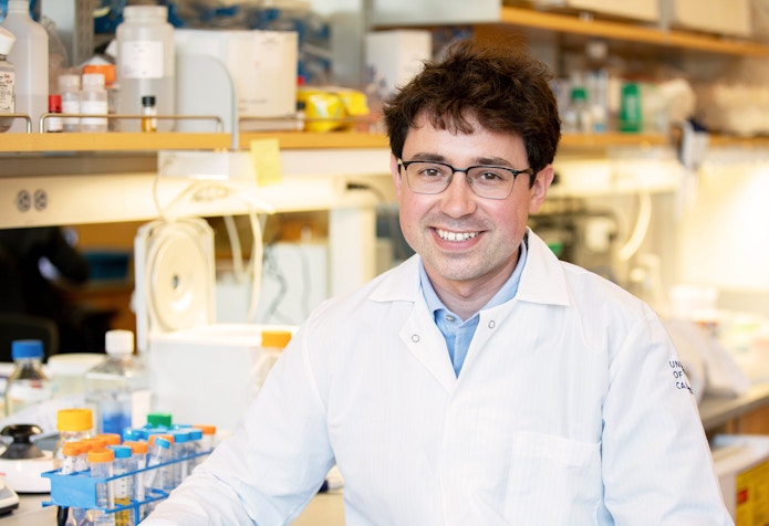 Photo of Tomasz Nowakowski at UCSF Neurosurgery building in the research lab.