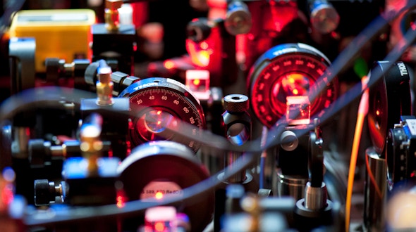 Photo of the complex setup of laser beams that manipulates the ultra cold atoms.