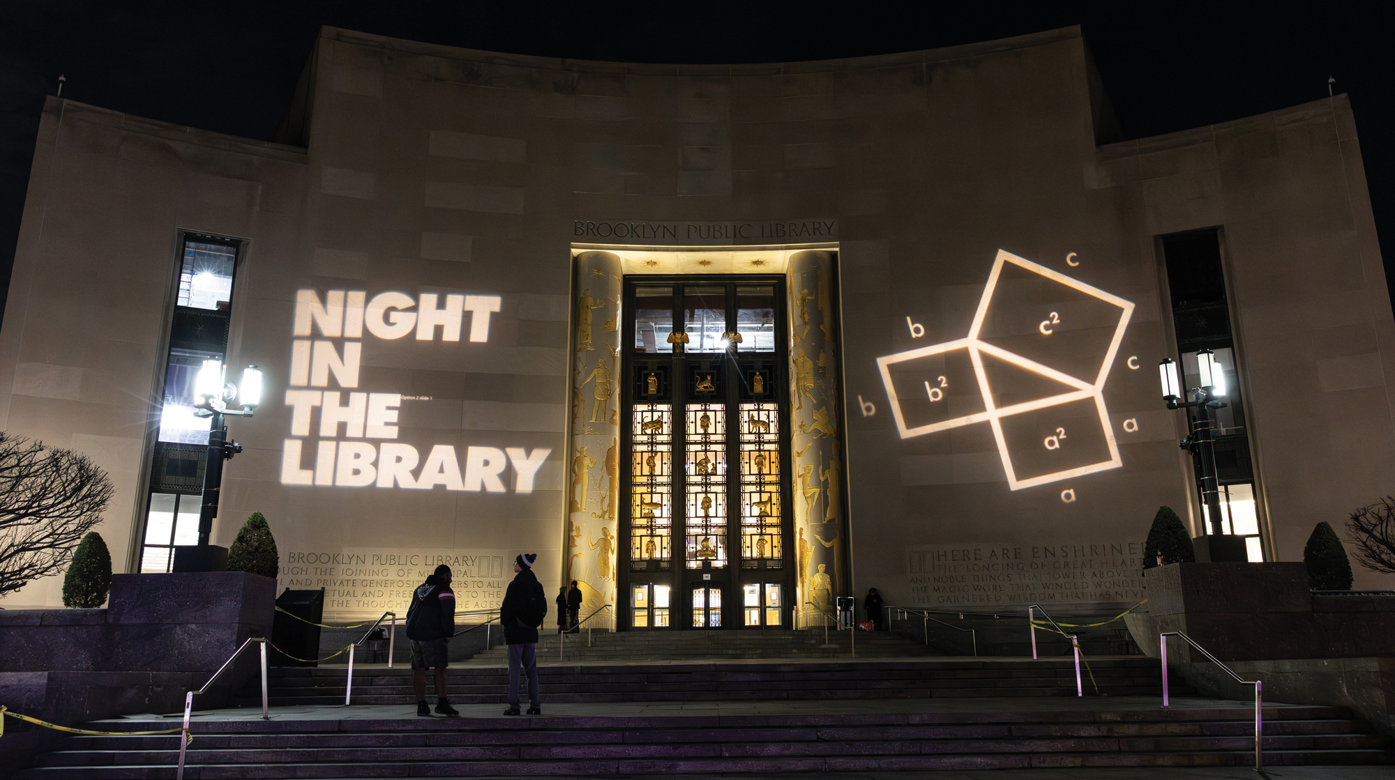 Photo of the entrance to the Brooklyn Public Library at night time.