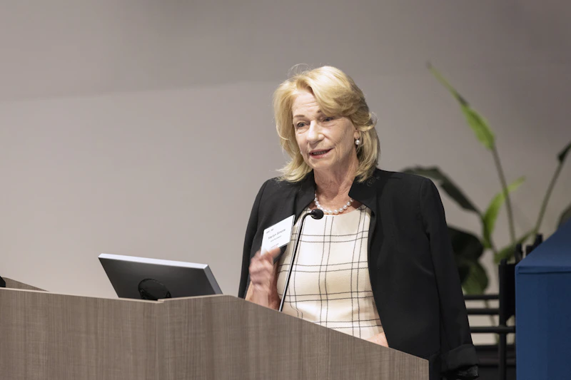 Photo of Marilyn Simons Introducing the summit