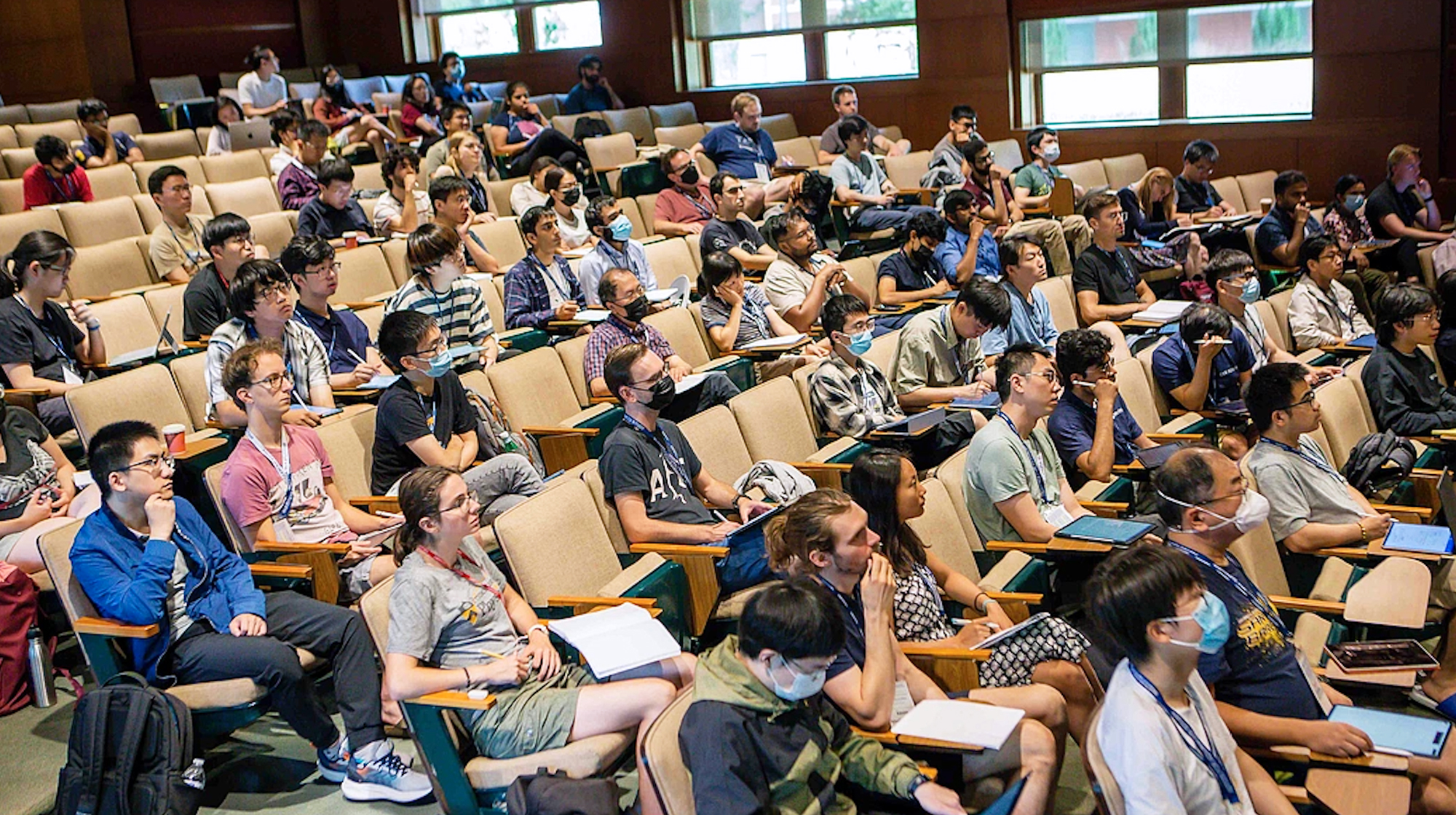 A photo of many people in an auditorium.