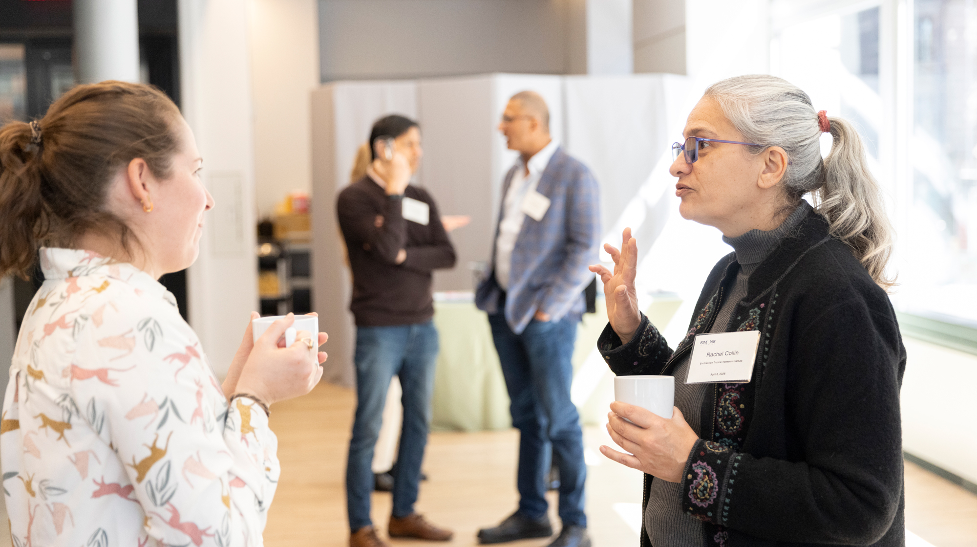People talking during the break during the Pivot meeting.