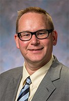 Headshot of SFARI Investigator Eric Butter.