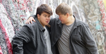 Photo of two brothers hugging each other.